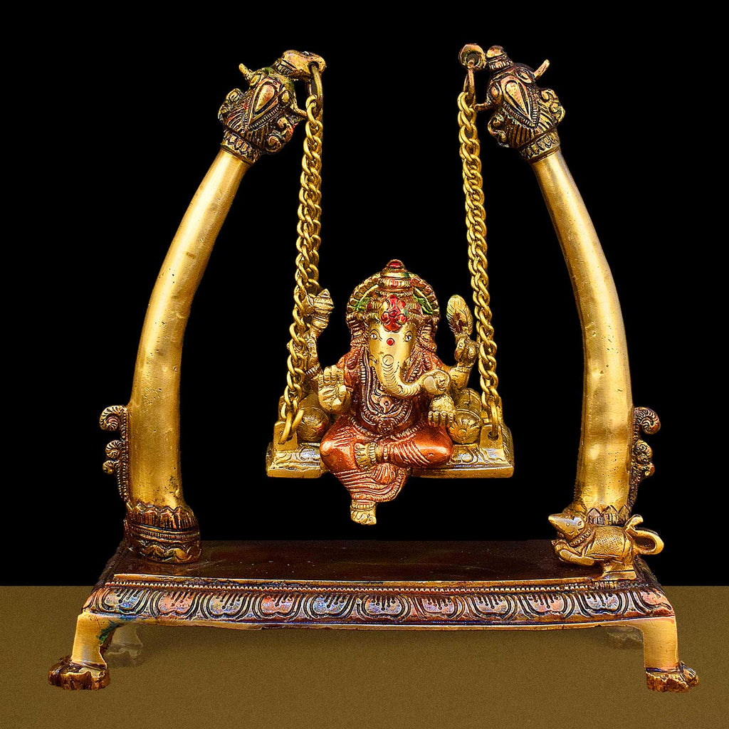 10.2-inch brass Ganpati idol seated on a decorative swing (jhula), beautifully crafted for devotion, home decor, and festive celebrations. India’s Largest Brass Idols Brand - www.satvikstore.in
