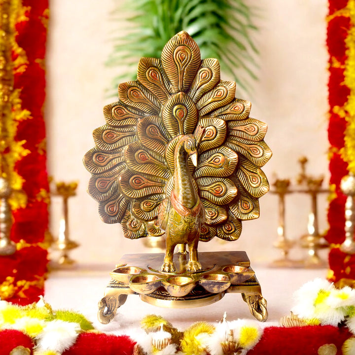 Satvik Stores Presents Stylish Peacock Panch Diya.&nbsp;Any festive occasion will be made wonderfully auspicious by the grace and beauty of the Peacock Brass Handcrafted Hanging Diya. Given that it was made by hand, the piece's abnormalities and flaws only serve to enhance Diya's allure and charisma. 