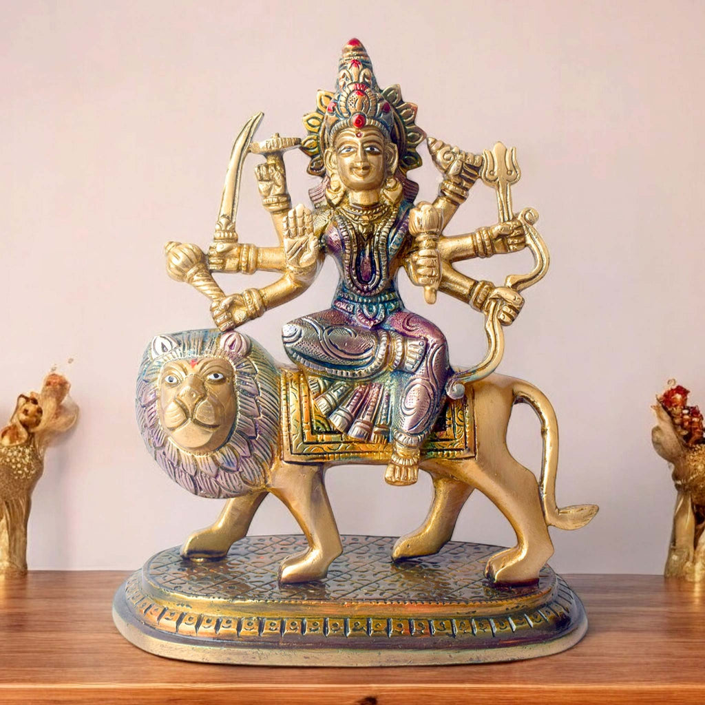  Embrace the powerful energy of Maa Durga with this 8.5-inch Brass 8-Armed Durga Idol, beautifully depicted riding her mighty lion. This meticulously crafted statue showcases Maa Durga in her most majestic form, symbolizing strength, courage, and divine protection. 