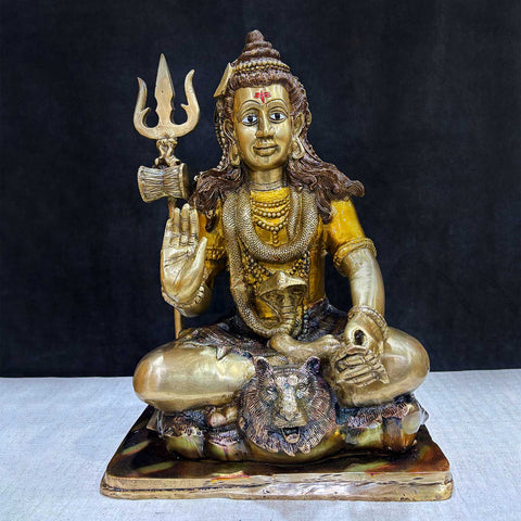  Brass Idol of 17.5 Inch Brass Lord Shiva Statue in Meditation Pose. Embodying peace and spiritual focus, this 17.5-inch Brass Shiva Idol features Lord Shiva in a serene meditative posture. Known as the ultimate yogi, Lord Shiva is beautifully represented here with intricate detailing in brass, capturing the tranquility and profound wisdom of his meditation on. India's Largest Puja Accessories Brand - Satvik No 1 Brass Idol Collection.