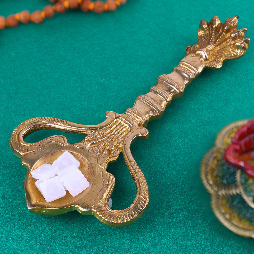 Brass Pooja Aarti Sheshnaag Spoon, a beautifully designed brass spoon featuring the Sheshnaag (serpent) motif, used for performing aarti during pooja and spiritual rituals. 
India’s Largest Pooja Accessories Brand – www.satvikstore.in 
