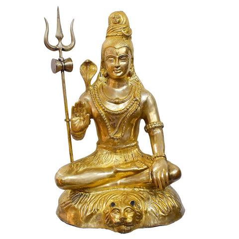 The handcrafted large brass statue of Lord Shiva is seated on a tiger skin, holding a Trishul and Damaru, glossy finish, weighing 35500 grams, height 80 cm, length 53 cm. Best for VIP Gift, best for big premium gift, best for your temple. India's Large Puja Accessories Brand - Satvikstore.in