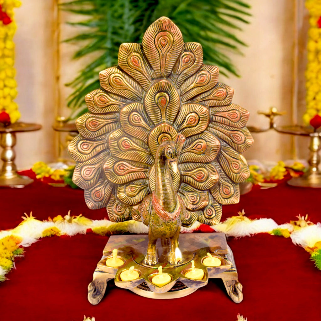 Satvik Stores Presents Stylish Peacock Panch Diya.&nbsp;Any festive occasion will be made wonderfully auspicious by the grace and beauty of the Peacock Brass Handcrafted Hanging Diya. Given that it was made by hand, the piece's abnormalities and flaws only serve to enhance Diya's allure and charisma. 