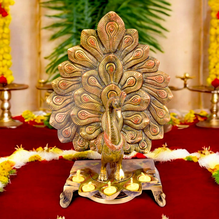 Satvik Stores Presents Stylish Peacock Panch Diya.&nbsp;Any festive occasion will be made wonderfully auspicious by the grace and beauty of the Peacock Brass Handcrafted Hanging Diya. Given that it was made by hand, the piece's abnormalities and flaws only serve to enhance Diya's allure and charisma. 