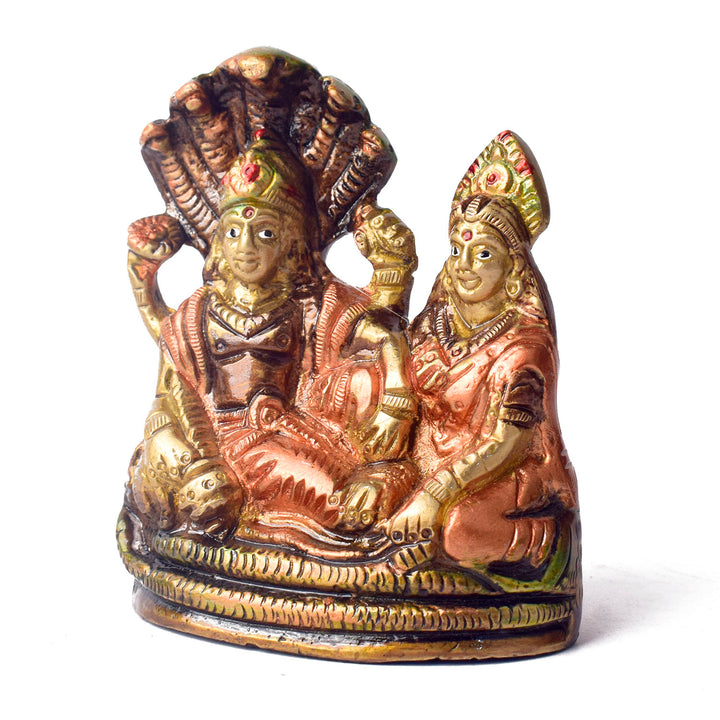  The 4.7 Inch Vishnu Ji Resting on Snake - Small Divine Figure is a beautifully crafted miniature statue that showcases Lord Vishnu in a serene and tranquil pose. Resting gracefully on the multi-headed serpent, Sheshnag, this divine figure symbolizes the eternal peace and protection Vishnu provides to the universe. 