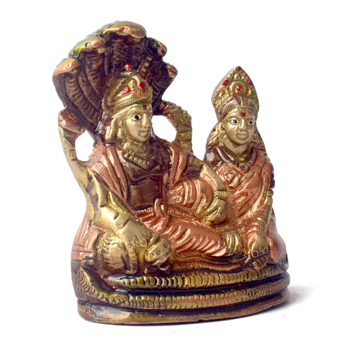  The 4.7 Inch Vishnu Ji Resting on Snake - Small Divine Figure is a beautifully crafted miniature statue that showcases Lord Vishnu in a serene and tranquil pose. Resting gracefully on the multi-headed serpent, Sheshnag, this divine figure symbolizes the eternal peace and protection Vishnu provides to the universe. 