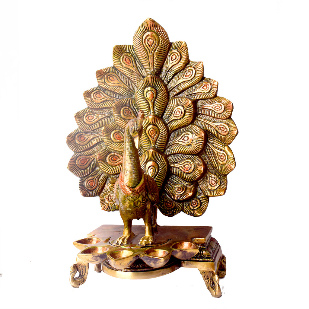 Satvik Stores Presents Stylish Peacock Panch Diya.&nbsp;Any festive occasion will be made wonderfully auspicious by the grace and beauty of the Peacock Brass Handcrafted Hanging Diya. Given that it was made by hand, the piece's abnormalities and flaws only serve to enhance Diya's allure and charisma. 