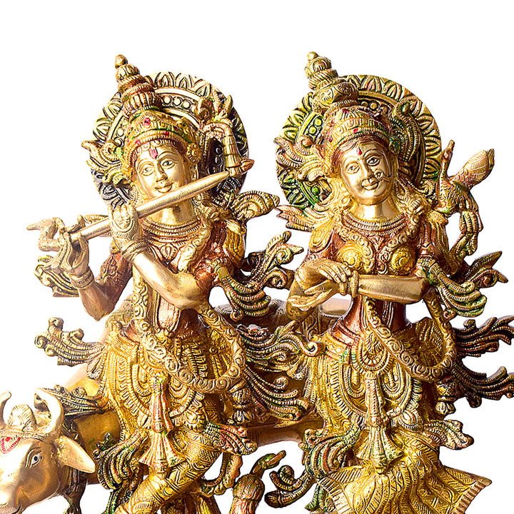 This Lovely Radha Krishna with Cow Colorful Brass Idol beautifully portrays the divine love and grace of Radha and Krishna, accompanied by the sacred cow. Handcrafted from high-quality brass and adorned with vibrant colors, this idol exudes spiritual charm and elegance.