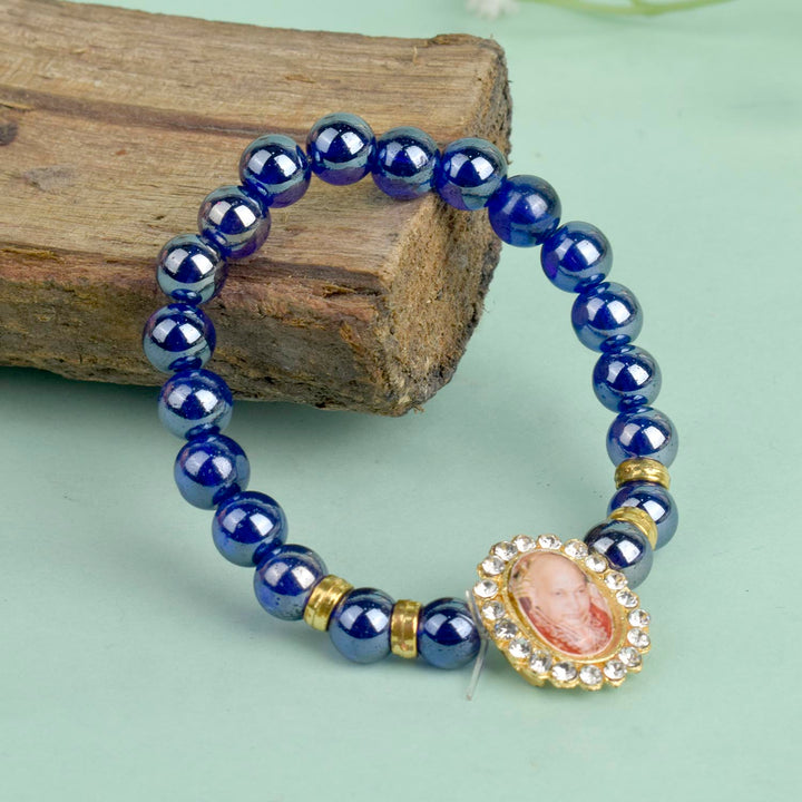 Dark Blue Shiny Beads Single Layer Guruji Swaroop Bracelet featuring shimmering dark blue beads and Jai Guruji Swaroop – perfect for minimalist spiritual wear, meditation, and gifting. India’s Largest Pooja Accessories Brand – www.satvikstore.in