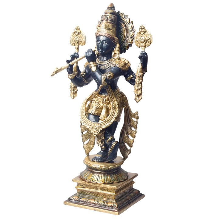 Large Brass Idol of 19 Inch Brass Chola Krishna Sculpture Playing the Flute. Bring home the divine charm of Lord Krishna with this exquisite 19-inch Brass Chola Krishna Sculpture. Expertly crafted, this statue captures Lord Krishna in his iconic pose, gracefully playing the flute.
