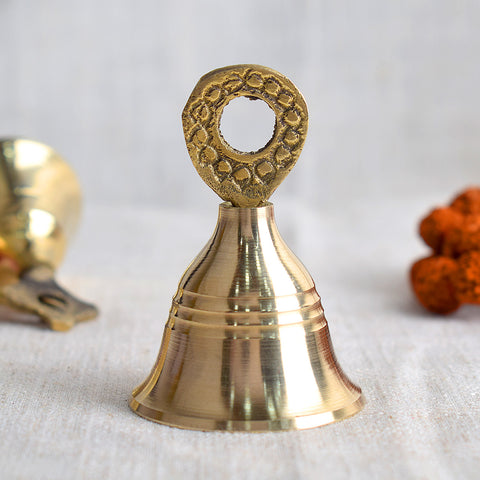 Elegant brass pooja bell with intricate design, symbolizing spiritual harmony and traditionally used during Hindu rituals and temple ceremonies. India’s Largest Pooja Accessories Brand – www.satvikstore.in