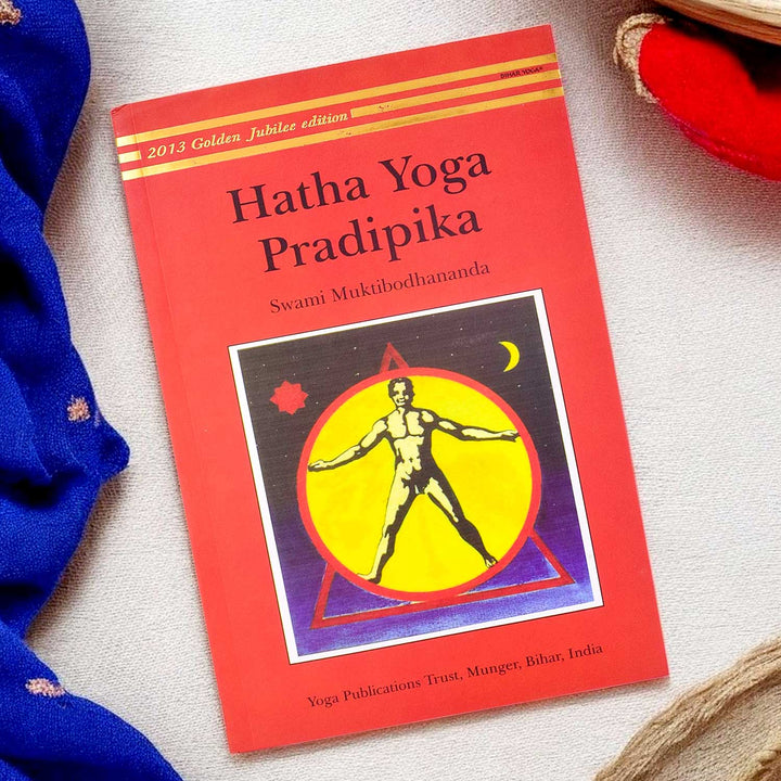 Front cover of the "Hatha Yoga Pradipika: Light on Hatha Yoga" paperback edition, a classical guide on traditional Hatha Yoga practices. India’s Largest Pooja Accessories Brand – www.satvikstore.in
