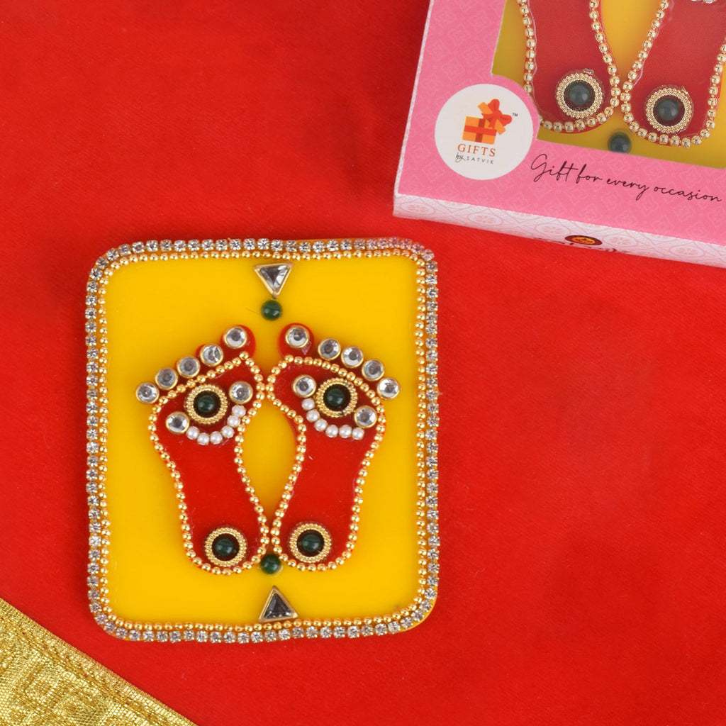 Laxmi Charan Acrylic Charan Paduka – The Sacred Footprints, clear and decorative acrylic representation of Goddess Lakshmi’s feet used in pooja rooms, home entrances, and Diwali decor. 
India’s Largest Pooja Accessories Brand – www.satvikstore.in 