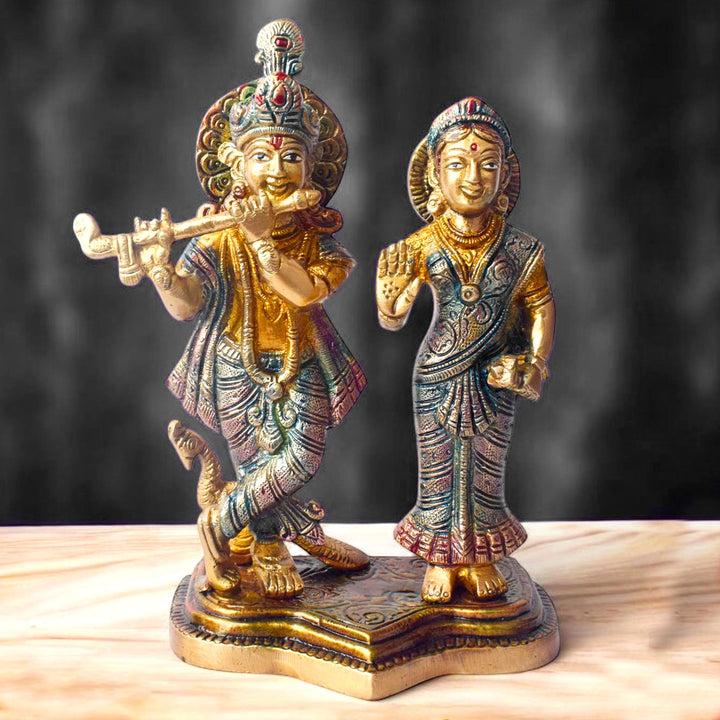 The 8 Inch Radha Krishna Idol – A Symbol of True Devotion and Love is a magnificent representation of the eternal bond between Radha and Krishna, capturing the purity and depth of their divine love. This beautifully crafted idol depicts Krishna playing his flute, while Radha stands beside him, radiating grace, love, and devotion.