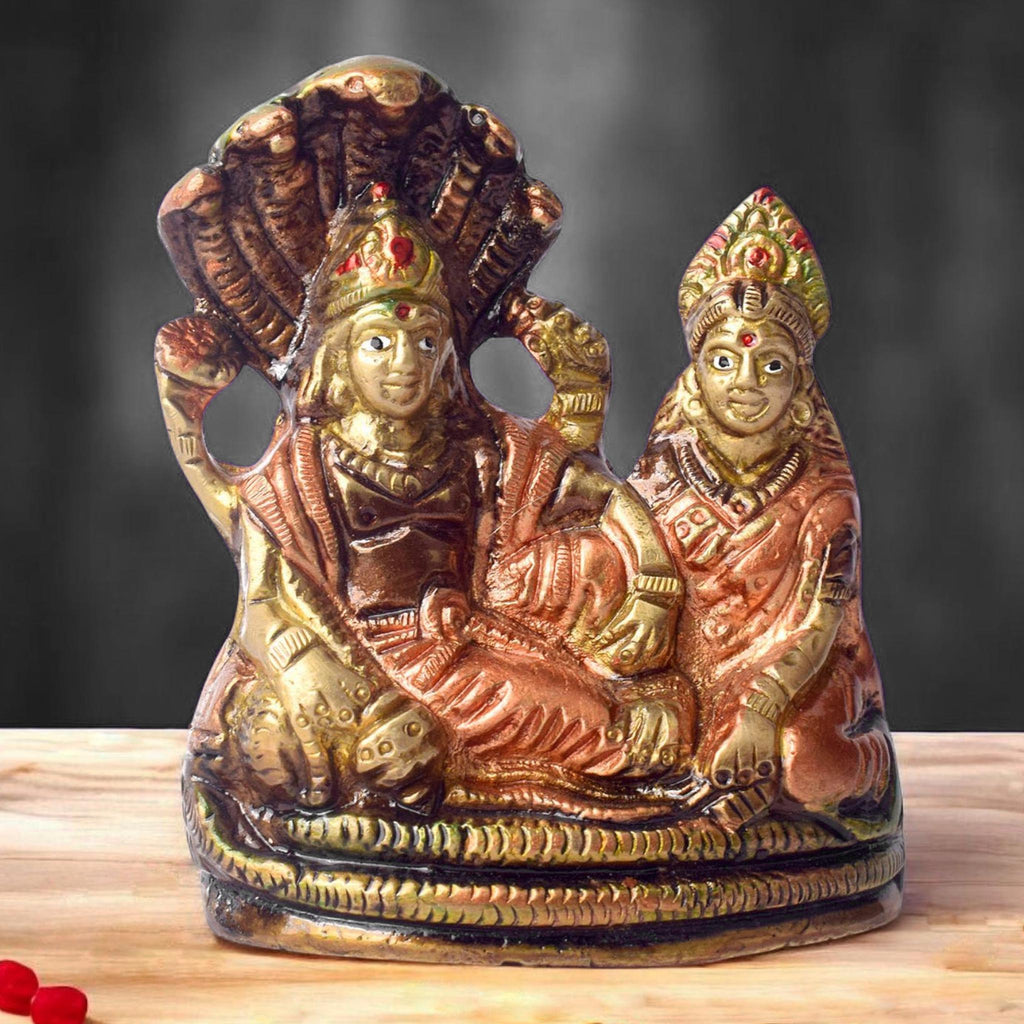  The 4.7 Inch Vishnu Ji Resting on Snake - Small Divine Figure is a beautifully crafted miniature statue that showcases Lord Vishnu in a serene and tranquil pose. Resting gracefully on the multi-headed serpent, Sheshnag, this divine figure symbolizes the eternal peace and protection Vishnu provides to the universe. 