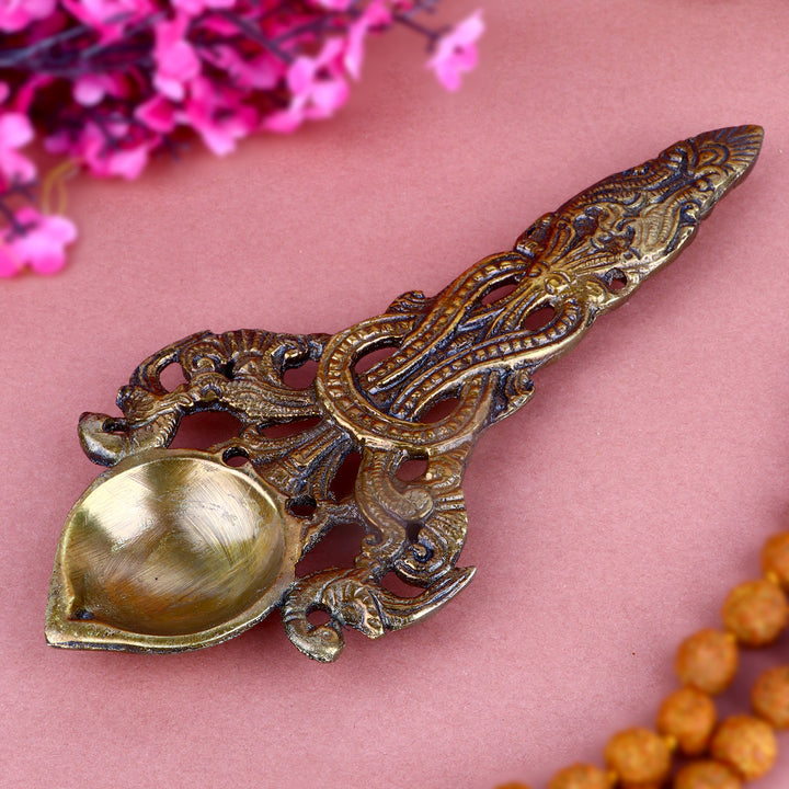 Designer Brass Pooja Aarti Spoon Small, an intricately designed small brass spoon used for performing aarti during pooja and spiritual rituals.
India’s Largest Pooja Accessories Brand – www.satvikstore.in 