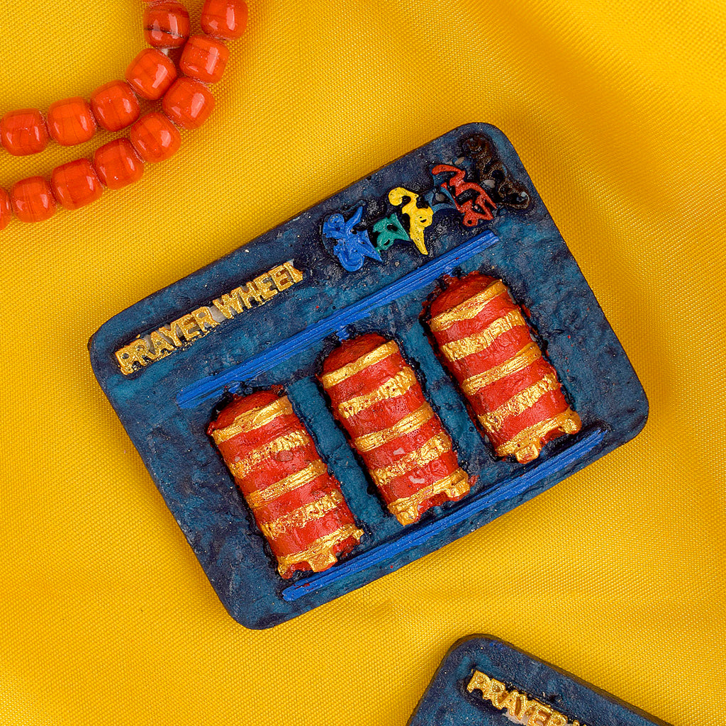 Prayer Wheel Buddha Fridge Magnet, featuring a spiritual prayer wheel and Buddha design, bringing positive energy, peace, and serenity to your home or office. India’s Largest Pooja Accessories Brand – www.satvikstore.in