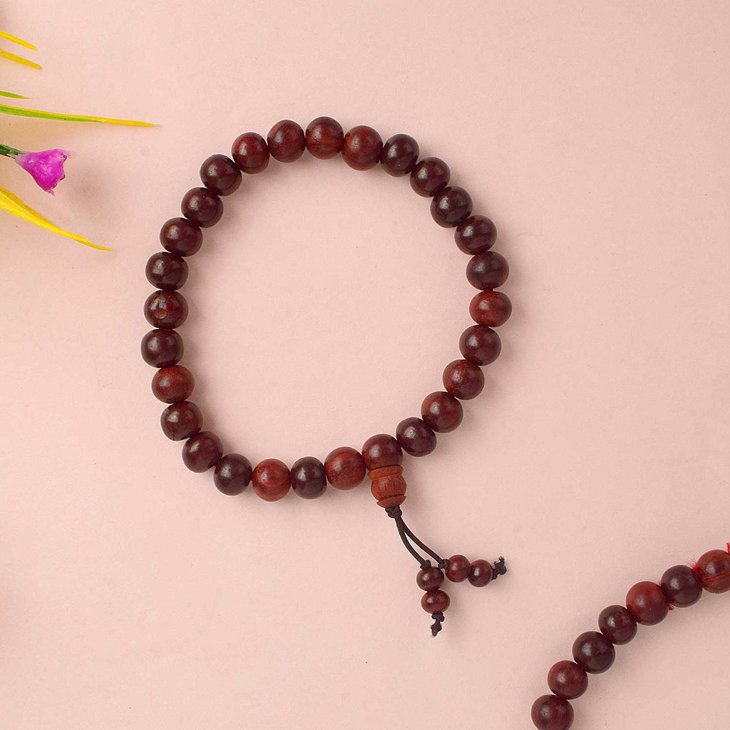 Beautiful handcrafted Red Chandan Bracelet made from pure red sandalwood beads, designed for enhancing spiritual balance, inner strength, and daily protection during meditation and pooja. India’s Largest Pooja Accessories Brand - www.satvikstore.in

