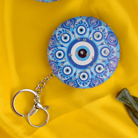 Stylish Round Evil Eye Keychain with Foldable Mirror – Practical and protective charm for everyday use. India’s Largest Pooja Accessories Brand – www.satvikstore.in