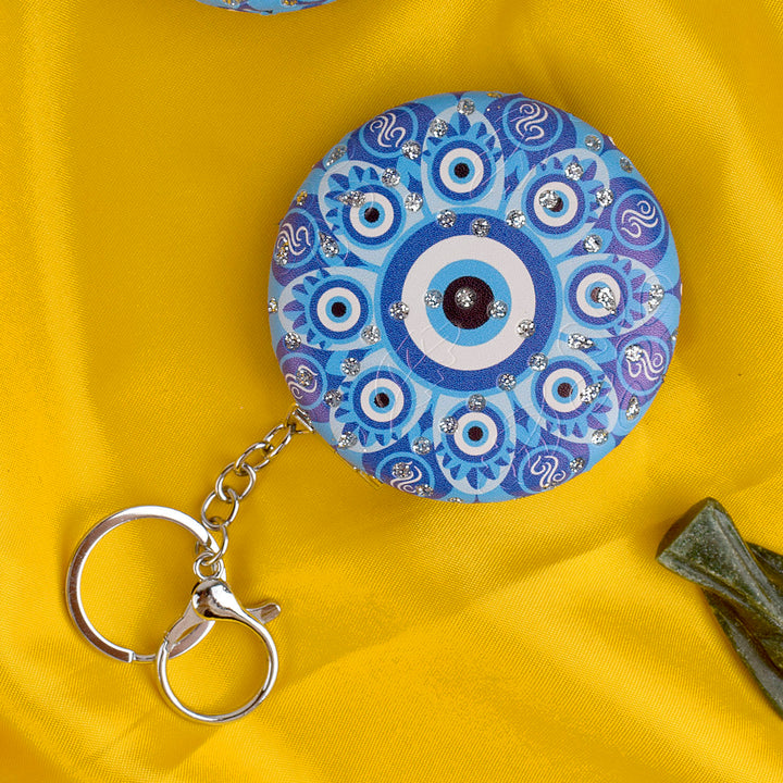 Stylish Round Evil Eye Keychain with Foldable Mirror – Practical and protective charm for everyday use. India’s Largest Pooja Accessories Brand – www.satvikstore.in