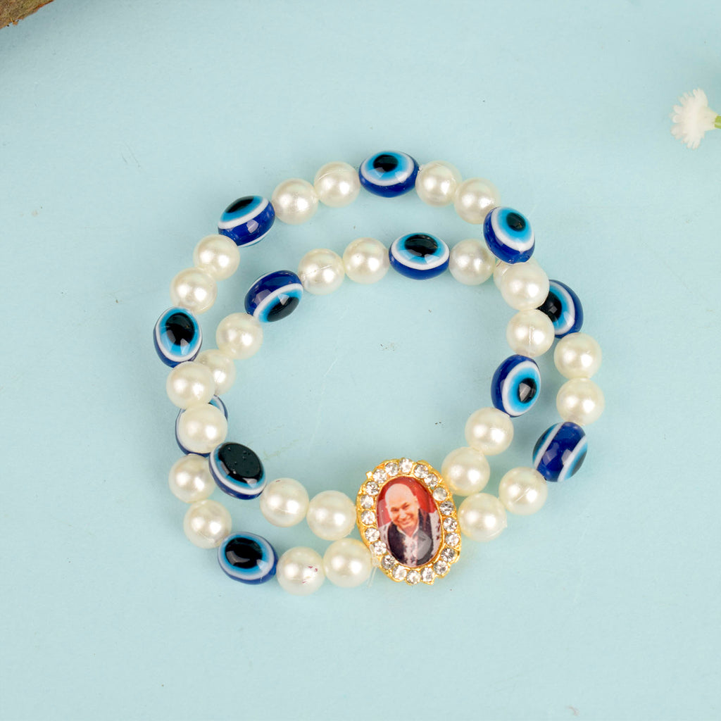White Pearl with Evil Eye Double Layer Guruji Swaroop Bracelet featuring luminous pearls and a protective blue evil eye bead with Jai Guruji Swaroop – perfect for spiritual wear, protection, and gifting. India’s Largest Pooja Accessories Brand – www.satvikstore.in